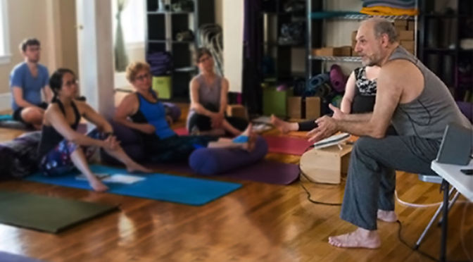 Leslie addressing students sitting around him